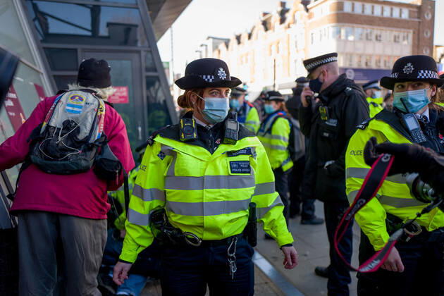 January 9, 2021, London, UK: Metropolitan police officers swarmed Clapham Common in on Saturday after anti-lockdown protesters gathered in the area. Group of demonstrators chanting â€oetake your freedom back†walked along the high street. Few demonstrators was arrested by Metropolitan Police officers. England s third national lockdown has legally come into force last week. The lockdown means people are able to leave their homes for limited reasons, with measures expected to stay in place until mid-February. London UK - ZUMAg173 20210109_zap_g173_023 Copyright: xVelarxGrantx