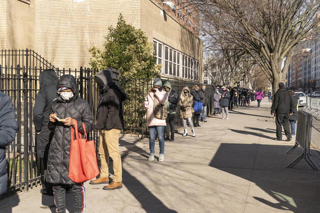 First day of mass vaccination in NYC People who are eligible and registered wait in line to get COVID-19 vaccine at South Bronx Educational Campus. People over 75, education workers, the police and firefighters, public transit and safety workers are eligible to get vaccine as group 1B. Group 1A includes healthcare workers. More than 600 people registered to get vaccinated on this location on the first day. New York New York United States Copyright: LevxRadin