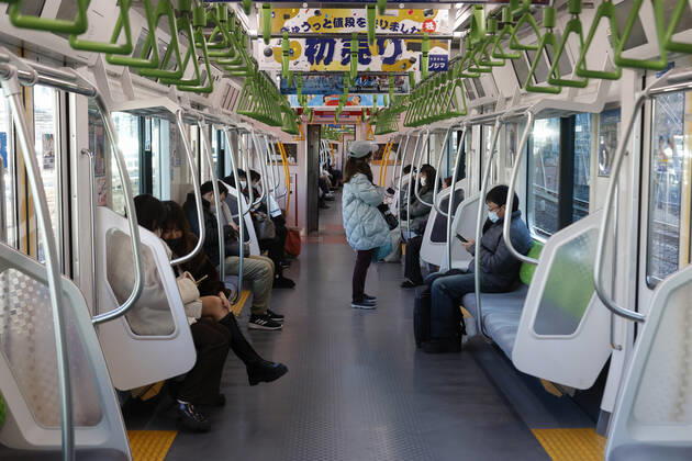 January 10, 2021, Tokyo, Japan: Fewer passenger than normal are seen inside a train during the first Sunday after the second state of emergency was declared in the capital. Tokyo reported 1,494 new COVID-19 cases on January 10; following four days of over 2,000 cases, the daily infections count dropped for the first time after the state of emergency was declared in Tokyo, Kanagawa, Saitama, and Chiba prefectures. Tokyo Japan - ZUMAm191 20210110_zap_m191_009 Copyright: xRodrigoxReyesxMarinx
