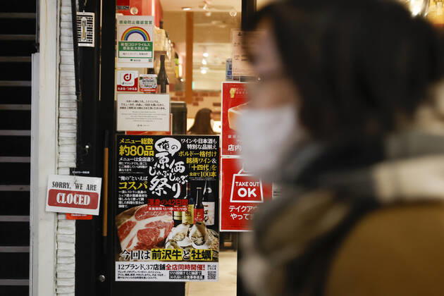 January 10, 2021, Tokyo, Japan: A woman wearing a face mask leaves Kabukicho (the red-light district of Tokyo) after the establishments closed at 8 pm to stop the COVID-19 infections in the capital. Tokyo reported 1,494 new COVID-19 cases on January 10; following four days of over 2,000 cases, the daily infections count dropped for the first time after the state of emergency was declared in Tokyo, Kanagawa, Saitama, and Chiba prefectures. Tokyo Japan - ZUMAm191 20210110_zap_m191_018 Copyright: xRodrigoxReyesxMarinx