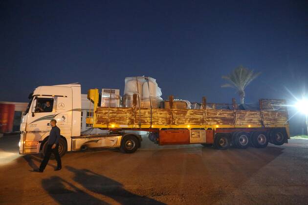 January 10, 2021, Rafah, Gaza Strip, Palestinian Territory: Palestinians receive medical aid from the United Arab Emirate, in Rafah border crossing in the southern of Gaza Strip, on January 10, 2021. The second shipment of Emirati medical aid arrived in the Gaza Strip this evening, which includes medical aid provided to the Ministry of Health in the Gaza Strip, to enhance health efforts in the face of the Corona pandemic, including an oxygen production plant with all its accessories, respirators and other medical equipment Rafah Palestinian Territory - ZUMAap3_ 20210110_zaf_ap3_094 Copyright: xAshrafxAmrax