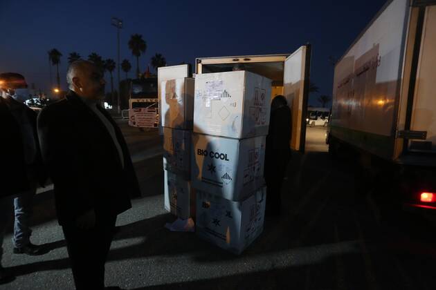 January 10, 2021, Rafah, Gaza Strip, Palestinian Territory: Palestinians receive medical aid from the United Arab Emirate, in Rafah border crossing in the southern of Gaza Strip, on January 10, 2021. The second shipment of Emirati medical aid arrived in the Gaza Strip this evening, which includes medical aid provided to the Ministry of Health in the Gaza Strip, to enhance health efforts in the face of the Corona pandemic, including an oxygen production plant with all its accessories, respirators and other medical equipment Rafah Palestinian Territory - ZUMAap3_ 20210110_zaf_ap3_106 Copyright: xAshrafxAmrax