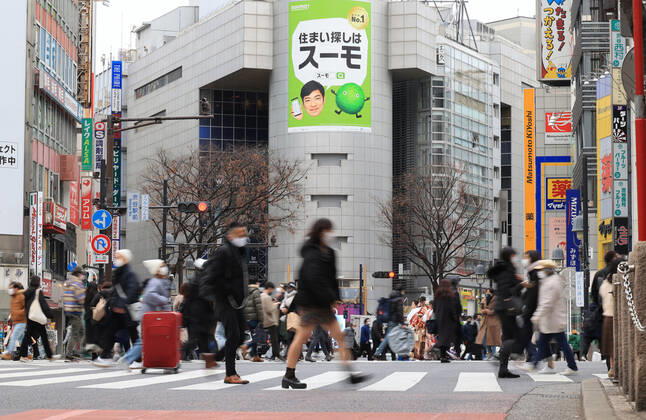 January 11, 2021, Tokyo, Japan -People cross a road at Shibuya fashion district amid outbreak of the new coronavirus in Tokyo on Monay, January 11, 2021 on a national holiday, Coming-of-Age Day. Prime Minister Yoshihide Suga declared a state of emergency on Tokyo and three neighboring prefectures.  (151812180)