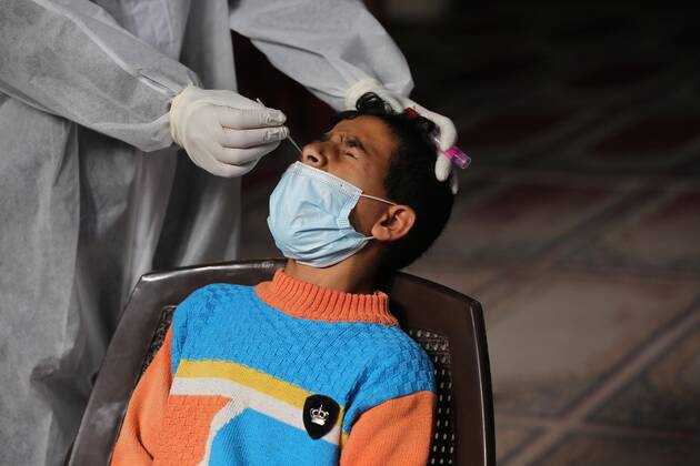 January 11, 2021, Deir Al-Balah, Gaza Strip, Palestinian Territory: A Palestinian medical worker wearing protective gear, takes a random swab sample for COVID-19 testing, in Deir al-Balah, central of Gaza Strip, on January 11, 2021. The Palestinian Authority (PA) has said it expects to receive its first COVID-19 vaccine doses in March under a deal with British drug giant AstraZeneca, and accused Israel of ignoring its responsibilities to ensure vaccines are available in occupied territory Deir Al-Balah Palestinian Territory - ZUMAap3_ 20210111_zaf_ap3_034 Copyright: xAshrafxAmrax