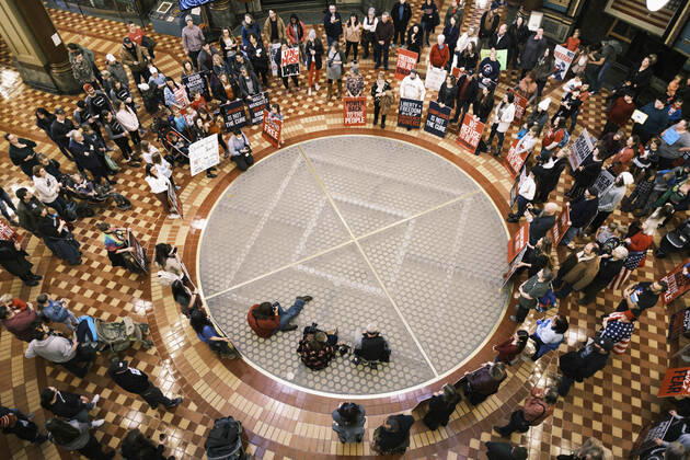 January 11, 2021, Des Moines, Iowa, U.S: People listen to speakers talk about personal freedoms and masks in the Rotunda of the Iowa State Capitol in Des Moines. Hundreds of Iowans from across the state came to the State Capitol to protest the Governor s COVID-19 mitigation efforts. The Coronavirus (SARS-CoV-2) mitigation guidelines include a mask mandate indoors when it isn t possible to social distance. But the Governor specifically exempted the State Capitol. No one in the crowd wore a mask and there was no effort to follow social distancing guidelines. There were also anti-Vaxxers in the crowd who protested the vaccine efforts and said vaccines were unsafe. Des Moines U.S. - ZUMAk94_ 20210111_zaf_k94_017 Copyright: xJackxKurtzx