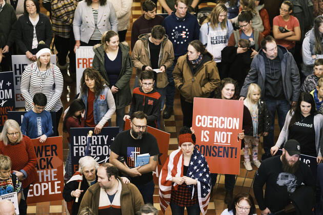January 11, 2021, Des Moines, Iowa, U.S: People listen to speakers talk about personal freedoms and masks in the Rotunda of the Iowa State Capitol in Des Moines. Hundreds of Iowans from across the state came to the State Capitol to protest the Governor s COVID-19 mitigation efforts. The Coronavirus (SARS-CoV-2) mitigation guidelines include a mask mandate indoors when it isn t possible to social distance. But the Governor specifically exempted the State Capitol. No one in the crowd wore a mask and there was no effort to follow social distancing guidelines. There were also anti-Vaxxers in the crowd who protested the vaccine efforts and said vaccines were unsafe. Des Moines U.S. - ZUMAk94_ 20210111_zaf_k94_018 Copyright: xJackxKurtzx