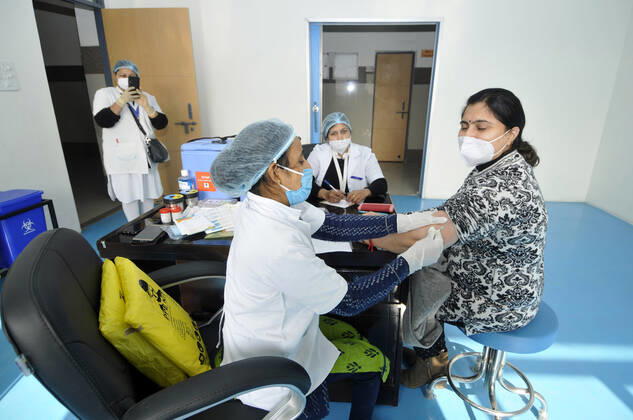 NOIDA, INDIA - JANUARY 11: Health workers conduct a dry-run of Covid-19 vaccine at Bhangel CHC hospital, on January 11, 2021 in Noida, India. Prime Minister Narendra Modi on Monday spoke on India s vaccination plan ahead of the mega Covid-19 vaccination drive, which is set to start on 16 January, 2021. Around 3 crore healthcare workers and frontline workers will be vaccinated in the first phase of vaccination. In the 2nd phase, those above 50 years and those under 50 years with co-morbid conditions will be vaccinated, the Prime Minister said. (Photo by Sunil Ghosh Hindustan Times) Covid-19 Vaccine Dry Run