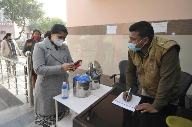 NOIDA, INDIA - JANUARY 11: Volunteers queue during a dry-run of Covid-19 vaccine at Bhangel CHC hospital, on January 11, 2021 in Noida, India. Prime Minister Narendra Modi on Monday spoke on India s vaccination plan ahead of the mega Covid-19 vaccination drive, which is set to start on 16 January, 2021. Around 3 crore healthcare workers and frontline workers will be vaccinated in the first phase of vaccination. In the 2nd phase, those above 50 years and those under 50 years with co-morbid conditions will be vaccinated, the Prime Minister said. (Photo by Sunil Ghosh Hindustan Times) Covid-19 Vaccine Dry Run