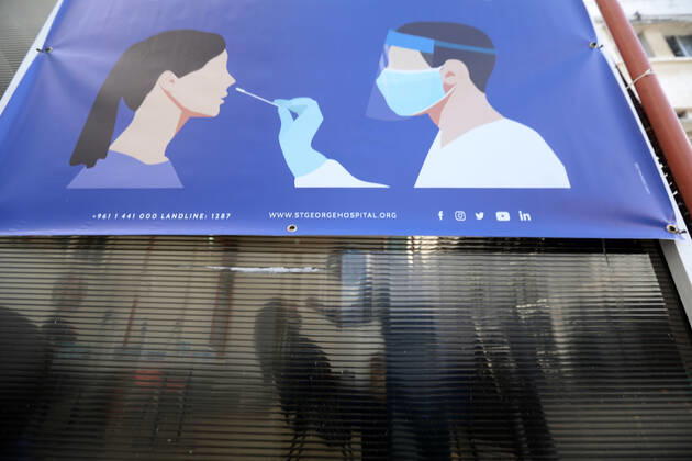 (210111) -- BEIRUT, Jan. 11, 2021 -- Photo taken on Jan. 11, 2021 shows a poster of PCR testing in Beirut, Lebanon. Lebanon s Higher Defense Council declared on Monday a state of emergency between Jan. 14-25 that includes a total lockdown in hope to restrict further spread of COVID-19, Al-Jadeed local TV channel reported. ) LEBANON-BEIRUT-COVID-19-STATE OF EMERGENCY BilalxJawich 