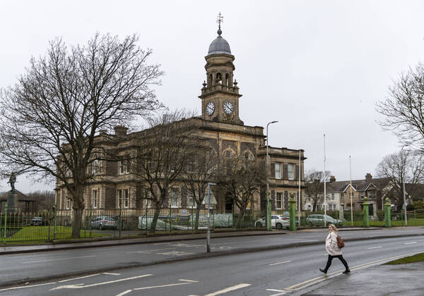 January 11, 2021, Carmarthenshire, United Kingdom: A lady crossing the road by the Llanelli town hall in Wales, UK on January 11, 2021. Professor Chris Whitty has warned the UK has not yet hit the peak of the current wave of Covide-19 infections, with the next few weeks being Ã¢â‚¬oethe worstÃ¢â‚¬Â of the pandemic for the NHS. Carmarthenshire United Kingdom - ZUMAj323 20210111_zip_j323_022 Copyright: xMayxJamesx
