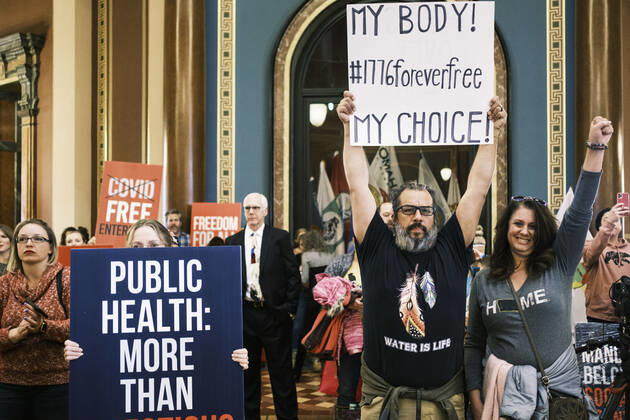 January 11, 2021, Des Moines, Iowa, U.S: People listen to speakers talk about personal freedoms and masks in the Rotunda of the Iowa State Capitol in Des Moines. Hundreds of Iowans from across the state came to the State Capitol to protest the Governor s COVID-19 mitigation efforts. The Coronavirus (SARS-CoV-2) mitigation guidelines include a mask mandate indoors when it isn t possible to social distance. But the Governor specifically exempted the State Capitol. No one in the crowd wore a mask and there was no effort to follow social distancing guidelines. There were also anti-Vaxxers in the crowd who protested the vaccine efforts and said vaccines were unsafe. Des Moines U.S. - ZUMAk94_ 20210111_zaf_k94_009 Copyright: xJackxKurtzx