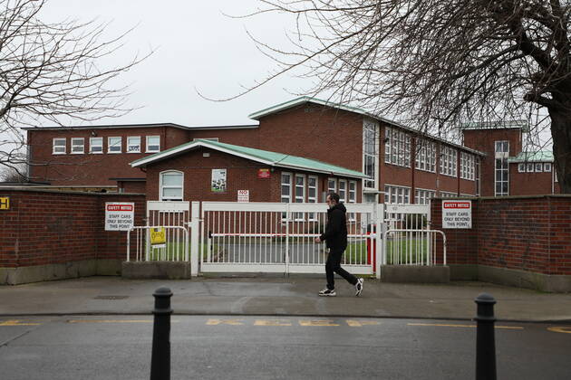 (210112) -- DUBLIN, Jan. 12, 2021 () -- A pedestrian walks past a school which has been closed amid the COVID-19 pandemic in Dublin, Ireland, Jan. 11, 2021. Due to the worsening COVID-19 situation in Ireland, all the schools in the country, which are supposed to be opened on Monday, have been asked to remain closed until Feb. 1, according to a decision announced by the Irish government. () IRELAND-COVID-19-SCHOOLS-CLOSURE Xinhua 