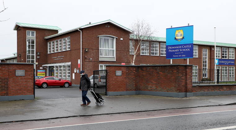(210112) -- DUBLIN, Jan. 12, 2021 () -- A pedestrian walks past a school which has been closed amid the COVID-19 pandemic in Dublin, Ireland, Jan. 11, 2021. Due to the worsening COVID-19 situation in Ireland, all the schools in the country, which are supposed to be opened on Monday, have been asked to remain closed until Feb. 1, according to a decision announced by the Irish government. () IRELAND-COVID-19-SCHOOLS-CLOSURE Xinhua 