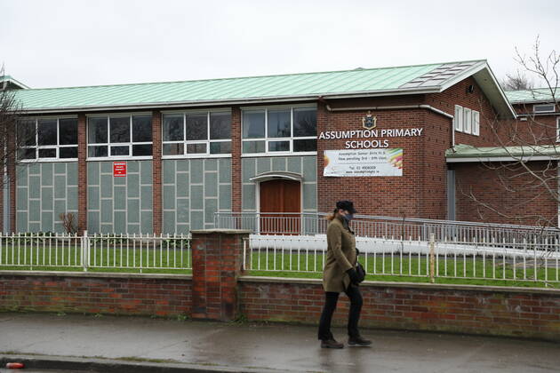 (210112) -- DUBLIN, Jan. 12, 2021 () -- A pedestrian walks past a school which has been closed amid the COVID-19 pandemic in Dublin, Ireland, Jan. 11, 2021. Due to the worsening COVID-19 situation in Ireland, all the schools in the country, which are supposed to be opened on Monday, have been asked to remain closed until Feb. 1, according to a decision announced by the Irish government. () IRELAND-COVID-19-SCHOOLS-CLOSURE Xinhua 