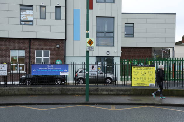 (210112) -- DUBLIN, Jan. 12, 2021 () -- A pedestrian walks past a school which has been closed amid the COVID-19 pandemic in Dublin, Ireland, Jan. 11, 2021. Due to the worsening COVID-19 situation in Ireland, all the schools in the country, which are supposed to be opened on Monday, have been asked to remain closed until Feb. 1, according to a decision announced by the Irish government. () IRELAND-COVID-19-SCHOOLS-CLOSURE Xinhua 