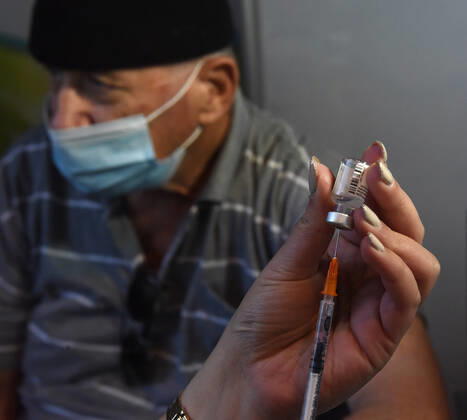 A nurse prepares a syringe with the Pfizer- BioNTech COVID-19 vaccine in an Israeli vaccination center in Jerusalem, on Tuesday, January 12, 2021. Israel will expand the vaccination drive inoculating teachers and people over 50 years on Wednesday.  JER2021011207 DEBBIExHILL