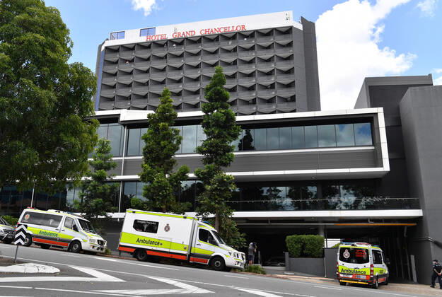 QLD CORONAVIRUS COVID19, Ambulances are seen lined up outside the Hotel Grand Chancellor in Brisbane, Wednesday, January 13, 2021. The Queensland government is shutting the Hotel Grand Chancellor which is currently operating as a quarantine hotel after six people staying there contracted the deadly UK strain of coronavirus. ( NO ARCHIVING, EDITORIAL USE ONLY, NO USE IN BOOKS WITHOUT CONSENT BRISBANE QLD AUSTRALIA  Copyright: xDARRENxENGLANDx 20210113001513351451