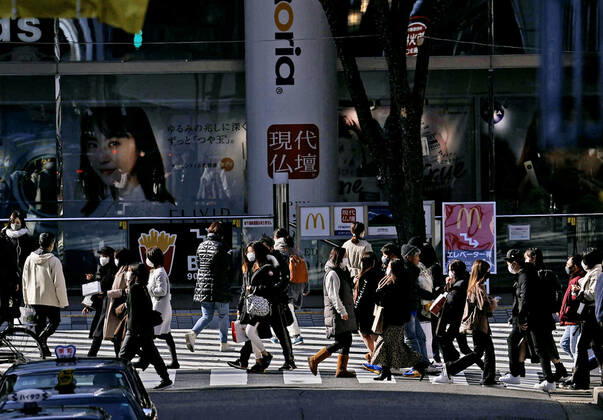 Expansion of coronavirus state of emergency in Japan People wearing face masks walk in Nagoya, central Japan, on Jan. 13, 2021, amid the coronavirus pandemic. Prime Minister Yoshihide Suga is set to declare a state of emergency in seven additional prefectures, including Aichi, later in the day, amid a resurgence of virus infections across the country. 