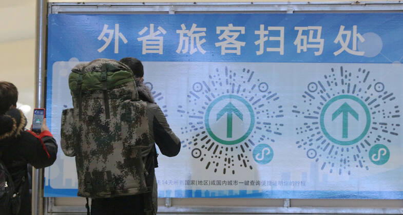 HARBIN, CHINA - JANUARY 12: Passengers use their smartphones to scan a QR code for health registration at Harbin Railway Station on January 12, 2021 in Harbin, Heilongjiang Province of China.  Copyright: xVCGx CFP111313724927