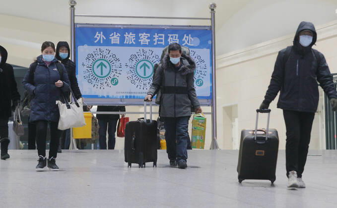 HARBIN, CHINA - JANUARY 12: Passengers walk to the exit after scanning a QR code for health registration at Harbin Railway Station on January 12, 2021 in Harbin, Heilongjiang Province of China.  Copyright: xVCGx CFP111313724928