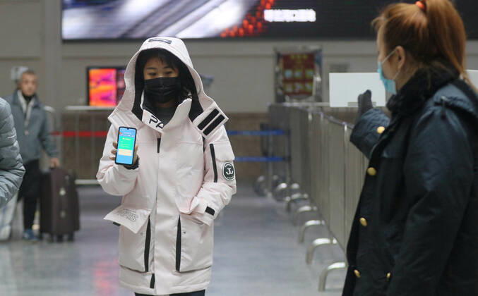 HARBIN, CHINA - JANUARY 12: Passengers present the health QR code on their smartphones at the exit of Harbin Railway Station on January 12, 2021 in Harbin, Heilongjiang Province of China.  Copyright: xVCGx CFP111313724932