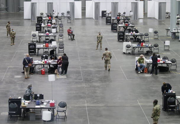 Tables and chairs are set up to deliver a COVID-19 vaccination to patients at the Jacob K. Javits Convention Center in New York City on Wednesday, January 13, 2021. The Javits Convention Center which served as a massive field hospital last spring when New York City was the epicenter of the pandemic, now will serve as a huge vaccine distribution center.  NYP20210113116 JohnxAngelillo