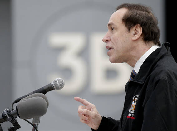 DOH Commissioner Howard Zucker speaks as patients arrive and go through the check in process to received a COVID-19 vaccination at the Jacob K. Javits Convention Center in New York City on Wednesday, January 13, 2021. The Javits Convention Center which served as a massive field hospital last spring when New York City was the epicenter of the pandemic, now will serve as a huge vaccine distribution center.  NYP20210113108 JohnxAngelillo