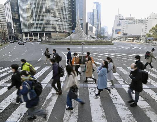 Day after Japan expands coronavirus emergency to 7 more prefectures People wearing face masks walk near JR Nagoya Station in the central Japan city on Jan. 14, 2021. Prime Minister Yoshihide Suga declared a state of emergency in seven additional prefectures, including Aichi, the previous day amid the continued spread of the novel coronavirus.