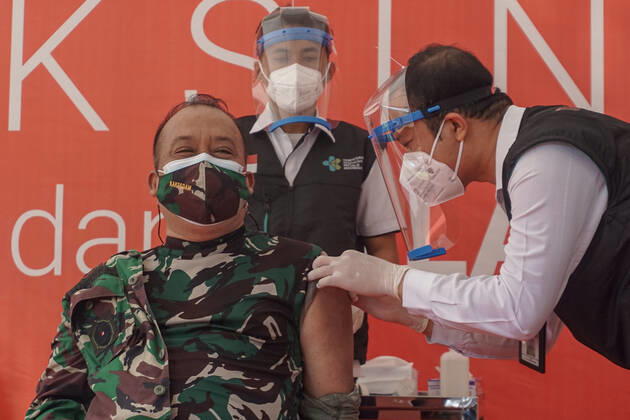 January 14, 2021, Denpasar, Bali, Indonesia: Bali province government top officials injected with Sinovac vaccine. Bali to start the first dose of Covid-19 vaccination program towards the public servants official and the health workers, which held at Bali Mandara Hospital. Denpasar Indonesia - ZUMAb245 20210114_zip_b245_008 Copyright: xDickyxBisinglasix