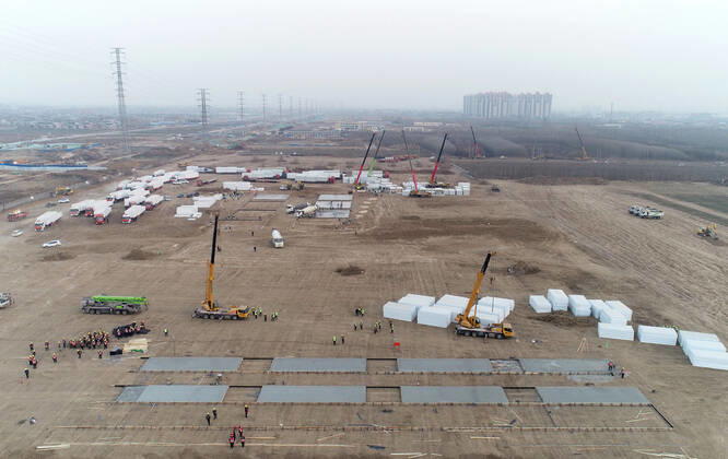 (210114) -- SHIJIAZHUANG, Jan. 14, 2021 -- Aerial photo shows the construction site of a centralized medical observation center in Shijiazhuang, capital of north China s Hebei Province, Jan. 14, 2021. Construction workers on Wednesday started building a centralized medical observation center in Shijiazhuang, where clustered COVID-19 cases occurred. The isolation center will likely cover 33 hectares of area near a village in Zhengding County, Shijiazhuang. Three integrated housing producers in Tangshan City, Hebei, have been entrusted to produce 3,000 makeshift wards for the center. Each ward has a space of 18 square meters. ) CHINA-HEBEI-SHIJIAZHUANG-ISOLATION CENTER-CONSTRUCTION (CN) YangxShiyao