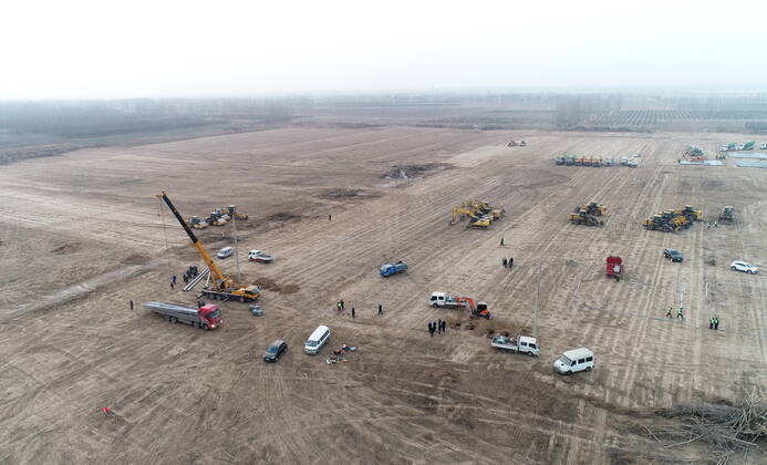 (210114) -- SHIJIAZHUANG, Jan. 14, 2021 -- Aerial photo shows the construction site of a centralized medical observation center in Shijiazhuang, capital of north China s Hebei Province, Jan. 14, 2021. Construction workers on Wednesday started building a centralized medical observation center in Shijiazhuang, where clustered COVID-19 cases occurred. The isolation center will likely cover 33 hectares of area near a village in Zhengding County, Shijiazhuang. Three integrated housing producers in Tangshan City, Hebei, have been entrusted to produce 3,000 makeshift wards for the center. Each ward has a space of 18 square meters. ) CHINA-HEBEI-SHIJIAZHUANG-ISOLATION CENTER-CONSTRUCTION (CN) YangxShiyao