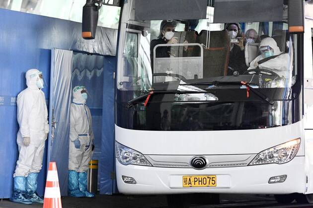 WHO team to investigate coronavirus origins in Wuhan A bus carrying a team of experts from the World Health Organization departs an airport in Wuhan on Jan. 14, 2021, after arriving in the Chinese city to investigate the origins of the novel coronavirus. The 10-member team is expected to conduct the research in Wuhan, where Chinese authorities reported the first coronavirus case in December 2019, for about two weeks, after being quarantined at a local hotel for about two weeks. 