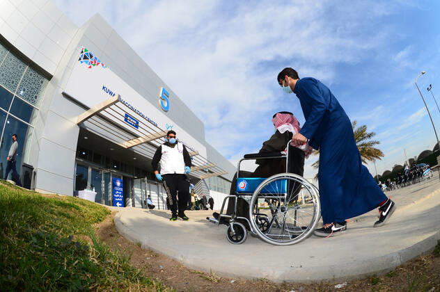 (210114) -- HAWALLI GOVERNORATE, Jan. 14, 2021 -- An elderly man is on his way to receive the second dose of COVID-19 vaccine at Kuwait Vaccination Center in Hawalli Governorate, Kuwait, Jan. 14, 2021. Kuwaiti people started to receive the second doses of COVID-19 vaccine on Thursday, as part of the national vaccination campaign at Kuwait Vaccination Center in Hawalli Governorate. (Photo by Xinhua) KUWAIT-HAWALLI GOVERNORATE-COVID-19-VACCINATION CAMPAIGN-SECOND DOSE Asad 