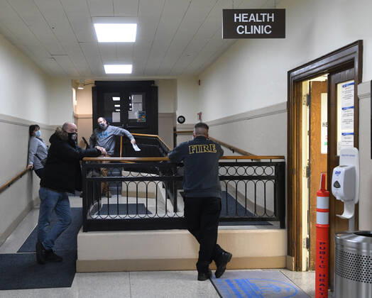 January 14, 2021, Racine, Wisconsin, USA: Firefighters wait for the vaccine clinic to open as the first 70 doses of 140 doses of the Pfizer COVID-19 vaccine received for City of Racine firefighters are administered Thursday January 14, 2021 at the city health department in City Hall. The remaining doses will be administered Friday. Racine USA - ZUMAh154 20210114_znp_h154_002 Copyright: xMarkxHertzbergx