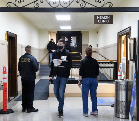 January 14, 2021, Racine, Wisconsin, USA: City Health Department Epidemiologist CODY PEARCE, center, oversees the logistics as the first of the first 70 doses of 140 doses of the Pfizer COVID-19 vaccine received for City of Racine firefighters are administered Thursday January 14, 2021 to at the city health department in City Hall. The remaining doses will be administered Friday. Racine USA - ZUMAh154 20210114_znp_h154_003 Copyright: xMarkxHertzbergx