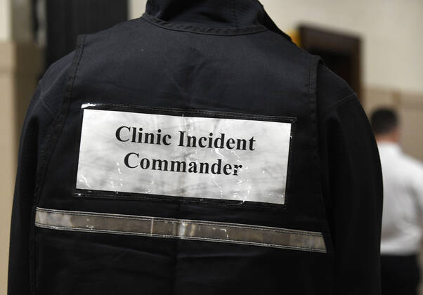 January 14, 2021, Racine, Wisconsin, USA: City Health Department Epidemiologist CODY PEARCE oversees the logistics as the first of the first 70 doses of 140 doses of the Pfizer COVID-19 vaccine received for City of Racine firefighters are administered Thursday January 14, 2021 to at the city health department in City Hall. The remaining doses will be administered Friday. Racine USA - ZUMAh154 20210114_znp_h154_004 Copyright: xMarkxHertzbergx