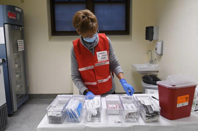 January 14, 2021, Racine, Wisconsin, USA: RN SANDRA HANSEN PREPARES the first 70 doses of 140 doses of the Pfizer COVID-19 vaccine received for City of Racine firefighters as they are administered Thursday January 14, 2021 at the city health department in City Hall. The remaining doses will be administered Friday. The vaccines are stored in the freezer, left rear of the photograph. Racine USA - ZUMAh154 20210114_znp_h154_013 Copyright: xMarkxHertzbergx
