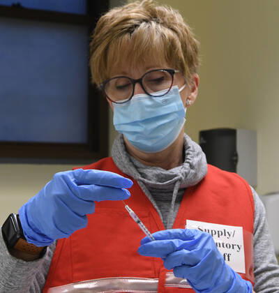 January 14, 2021, Racine, Wisconsin, USA: RN SANDRA HANSEN PREPARES the first 70 doses of 140 doses of the Pfizer COVID-19 vaccine received for City of Racine firefighters as they are administered Thursday January 14, 2021 at the city health department in City Hall. The remaining doses will be administered Friday. Racine USA - ZUMAh154 20210114_znp_h154_015 Copyright: xMarkxHertzbergx