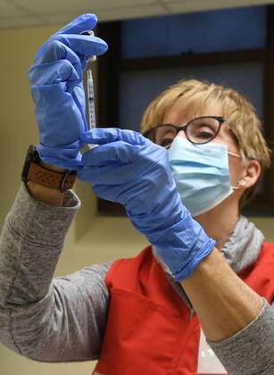 January 14, 2021, Racine, Wisconsin, USA: RN SANDRA HANSEN PREPARES the first 70 doses of 140 doses of the Pfizer COVID-19 vaccine received for City of Racine firefighters as they are administered Thursday January 14, 2021 at the city health department in City Hall. The remaining doses will be administered Friday. Racine USA - ZUMAh154 20210114_znp_h154_016 Copyright: xMarkxHertzbergx