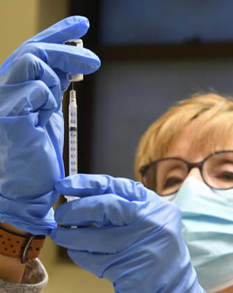 January 14, 2021, Racine, Wisconsin, USA: RN SANDRA HANSEN PREPARES the first 70 doses of 140 doses of the Pfizer COVID-19 vaccine received for City of Racine firefighters as they are administered Thursday January 14, 2021 at the city health department in City Hall. The remaining doses will be administered Friday. Racine USA - ZUMAh154 20210114_znp_h154_017 Copyright: xMarkxHertzbergx