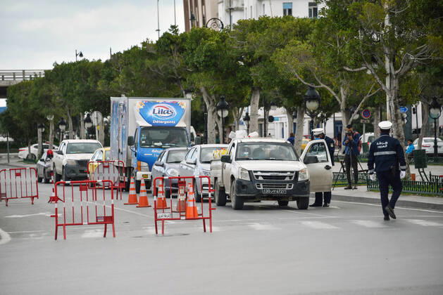 January 14, 2021, Tunis, Tunisia: A police roadblock to control citizens is pictured on the Tunis-la Marsa highway deserted amid of a lockdown due to the Covid-19 pandemic as the country marks 10 years since its revolution. Tunisia marked 10 years today since its street revolution sent autocratic ruler Zine El Abidine Ben Ali fleeing into exile, but few are celebrating amid a lockdown as Covid-19 cases spiral. Tunis Tunisia - ZUMAs197 20210114_zaa_s197_114 Copyright: xJdidixWassimx