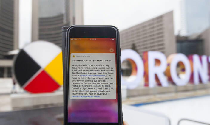 (210114) -- TORONTO, Jan. 14, 2021 -- Photo taken on Jan. 14, 2021 shows an emergency alert of a stay-at-home order on a cellphone in Toronto, Ontario, Canada. Ontario s stay-at-home order went into effect on Thursday, requiring residents to stay home except for essential outings. (Photo by Xinhua) CANADA-ONTARIO-COVID-19-STAY-AT-HOME ORDER ZouxZheng 