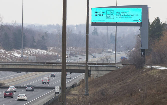 (210114) -- TORONTO, Jan. 14, 2021 -- A screen with a message of Ontario s stay-at-home order is seen on the side of Highway 403 in Missisauga, Ontario, Canada, on Jan. 14, 2021. Ontario s stay-at-home order went into effect on Thursday, requiring residents to stay home except for essential outings. (Photo by Xinhua) CANADA-ONTARIO-COVID-19-STAY-AT-HOME ORDER ZouxZheng 