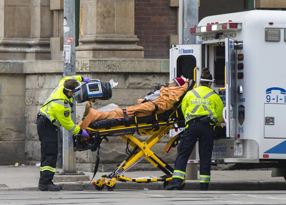 (210114) -- TORONTO, Jan. 14, 2021 -- A patient is wheeled into an ambulance in Toronto, Ontario, Canada, on Jan. 14, 2021. Ontario s stay-at-home order went into effect on Thursday, requiring residents to stay home except for essential outings. (Photo by Xinhua) CANADA-ONTARIO-COVID-19-STAY-AT-HOME ORDER ZouxZheng 