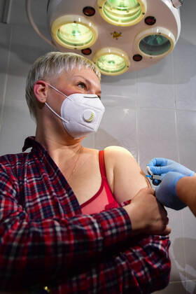 VLADIVOSTOK, RUSSIA - JANUARY 15, 2021: A woman is vaccinated with Gam-COVID-Vac (Sputnik V), a COVID-19 vaccine, at Outpatient Clinic No 6. Doctors and employees of the Russian Federal Service for Surveillance on Consumer Rights Protection and Human Wellbeing (Rospotrebnadzor) get vaccine first in Russia s Primorye Territory. Yuri Smityuk TASS  TS0F4384