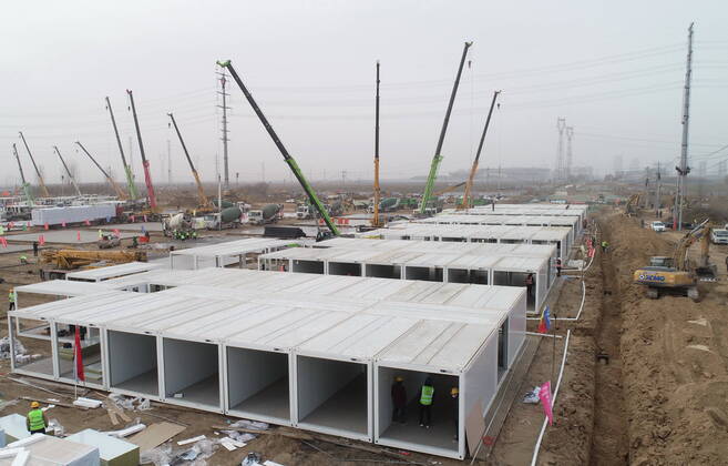 (210115) -- SHIJIAZHUANG, Jan. 15, 2021 (Xinhua) -- Aerial photo taken on Jan. 15, 2021 shows the construction site of a centralized medical observation center in Shijiazhuang, capital of north China s Hebei Province. As part of the measures to cope with the recent COVID-19 resurgence, authorities in Shijiazhuang have rushed to build a new isolation center with a designed capacity of 3,000 rooms in Zhengding County. Close contacts and sub-close contacts of confirmed COVID-19 patients will be placed under medical observation in the new center, which will cover a total area of about 33.3 hectares, according to the housing and urban-rural development bureau of Shijiazhuang. With an area of 18 square meters, each room will be equipped wit  - ZUMAHIJI XxjpbeE007296_20210115_PEPFN0A001 Copyright: xYangxShiyaox