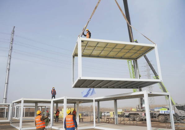 (210115) -- SHIJIAZHUANG, Jan. 15, 2021 (Xinhua) -- People work at the construction site of a centralized medical observation center in Shijiazhuang, capital of north China s Hebei Province, Jan. 15, 2021. As part of the measures to cope with the recent COVID-19 resurgence, authorities in Shijiazhuang have rushed to build a new isolation center with a designed capacity of 3,000 rooms in Zhengding County. Close contacts and sub-close contacts of confirmed COVID-19 patients will be placed under medical observation in the new center, which will cover a total area of about 33.3 hectares, according to the housing and urban-rural development bureau of Shijiazhuang. With an area of 18 square meters, each room will be equipped with facilities - ZUMAHIJI XxjpbeE007299_20210115_PEPFN0A001 Copyright: xYangxShiyaox