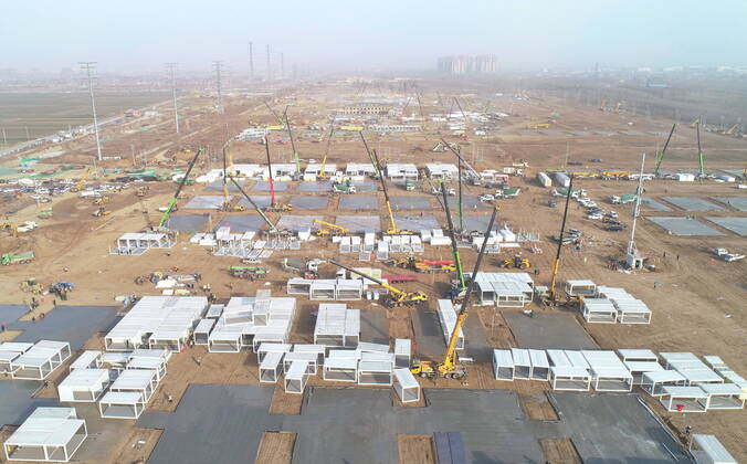(210115) -- SHIJIAZHUANG, Jan. 15, 2021 (Xinhua) -- Aerial photo taken on Jan. 15, 2021 shows the construction site of a centralized medical observation center in Shijiazhuang, capital of north China s Hebei Province. As part of the measures to cope with the recent COVID-19 resurgence, authorities in Shijiazhuang have rushed to build a new isolation center with a designed capacity of 3,000 rooms in Zhengding County. Close contacts and sub-close contacts of confirmed COVID-19 patients will be placed under medical observation in the new center, which will cover a total area of about 33.3 hectares, according to the housing and urban-rural development bureau of Shijiazhuang. With an area of 18 square meters, each room will be equipped wit  - ZUMAHIJI XxjpbeE007301_20210115_PEPFN0A001 Copyright: xYangxShiyaox