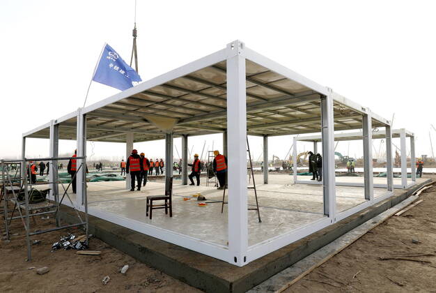 (210115) -- SHIJIAZHUANG, Jan. 15, 2021 (Xinhua) -- People work at the construction site of a centralized medical observation center in Shijiazhuang, capital of north China s Hebei Province, Jan. 15, 2021. As part of the measures to cope with the recent COVID-19 resurgence, authorities in Shijiazhuang have rushed to build a new isolation center with a designed capacity of 3,000 rooms in Zhengding County. Close contacts and sub-close contacts of confirmed COVID-19 patients will be placed under medical observation in the new center, which will cover a total area of about 33.3 hectares, according to the housing and urban-rural development bureau of Shijiazhuang. With an area of 18 square meters, each room will be equipped with facilities - ZUMAHIJI XxjpbeE007303_20210115_PEPFN0A001 Copyright: xYangxShiyaox