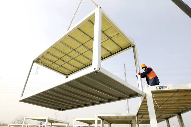 (210115) -- SHIJIAZHUANG, Jan. 15, 2021 (Xinhua) -- A constructor works at the construction site of a centralized medical observation center in Shijiazhuang, capital of north China s Hebei Province, Jan. 15, 2021. As part of the measures to cope with the recent COVID-19 resurgence, authorities in Shijiazhuang have rushed to build a new isolation center with a designed capacity of 3,000 rooms in Zhengding County. Close contacts and sub-close contacts of confirmed COVID-19 patients will be placed under medical observation in the new center, which will cover a total area of about 33.3 hectares, according to the housing and urban-rural development bureau of Shijiazhuang. With an area of 18 square meters, each room will be equipped with fa - ZUMAHIJI XxjpbeE007306_20210115_PEPFN0A001 Copyright: xYangxShiyaox